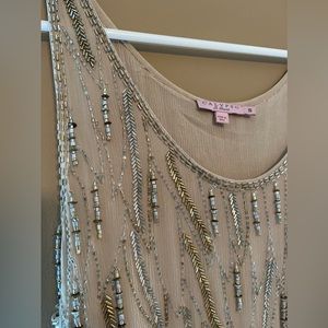 Heavily beaded silk lined, gold top with asymmetrical bottom